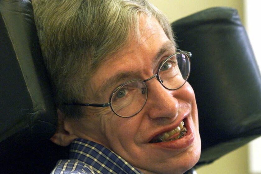 FILE - In this Wednesday, July 21, 1999 file photo Professor Stephen Hawking smiles during a news conference at the University of Potsdam, near Berlin, Germany. Hawking, whose brilliant mind ranged across time and space though his body was paralyzed by disease, has died, a family spokesman said early Wednesday, March 14, 2018.(AP Photo/Markus Schreiber, File)