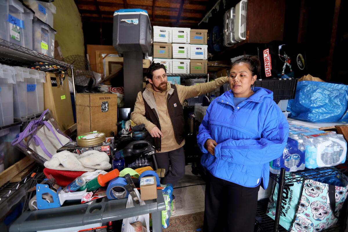 Cody Recker and Jessica Perez had to store many of their belongings in the garage at their rental home in Pasadena.