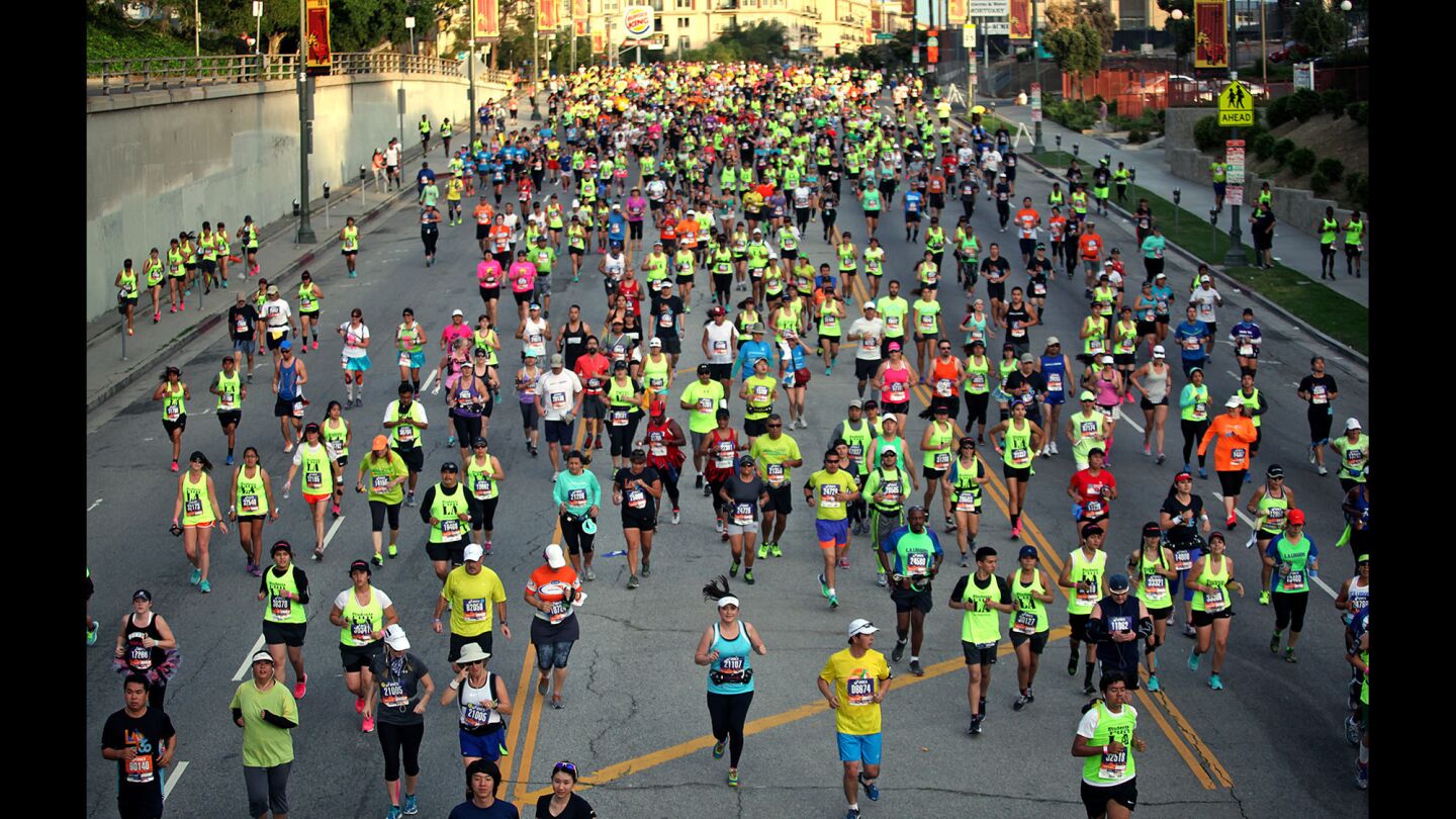 Runners pass through downtown Los Angeles during the 30th Los Angeles Marathon.