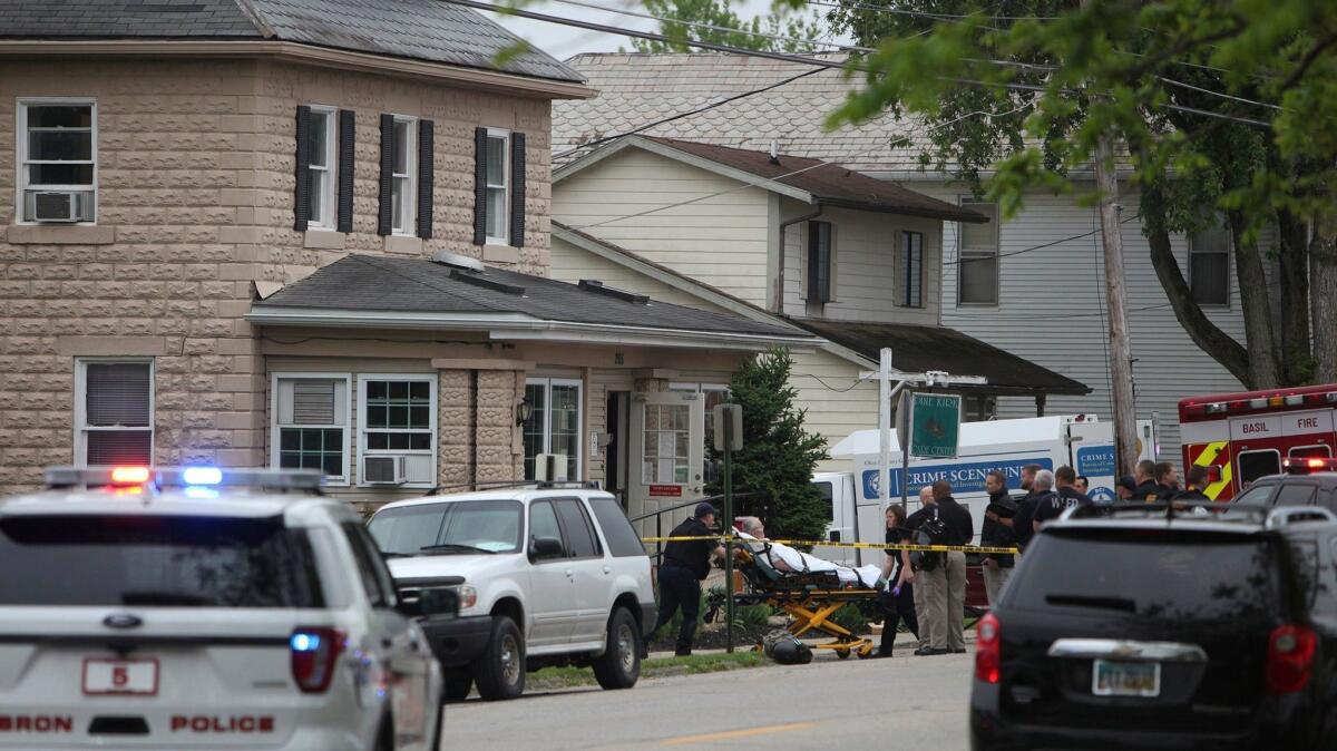 A person is removed from the Pine Kirk nursing home in Kirkersville, Ohio, on Friday.