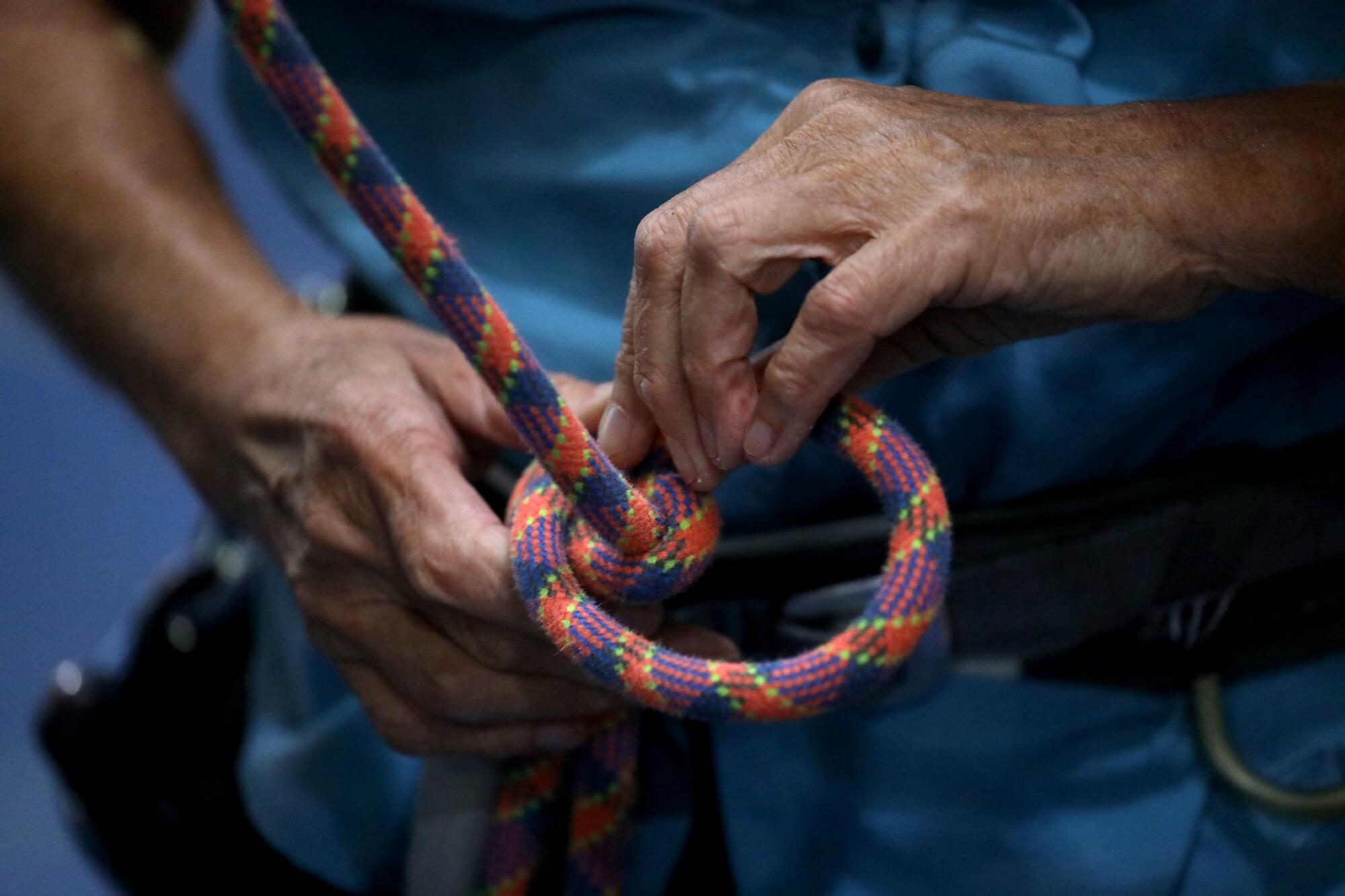 Dierdre Wolownick prepares ropes before climbing at Sacramento Pipeworks.