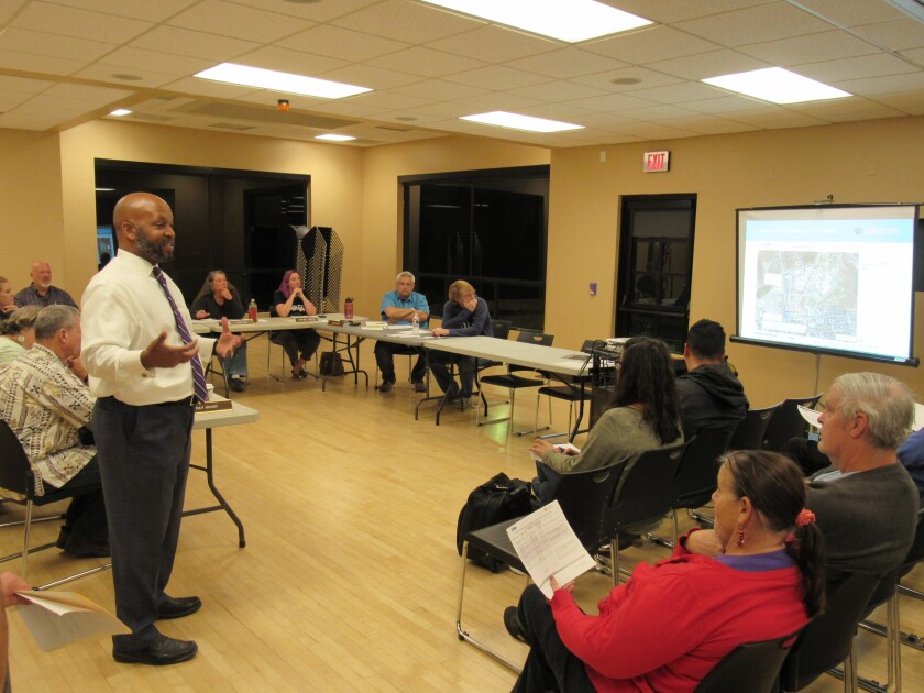 Omar Passons, director of the county's Office of Homeless Solutions, speaks to Lakeside residents on Dec. 1.