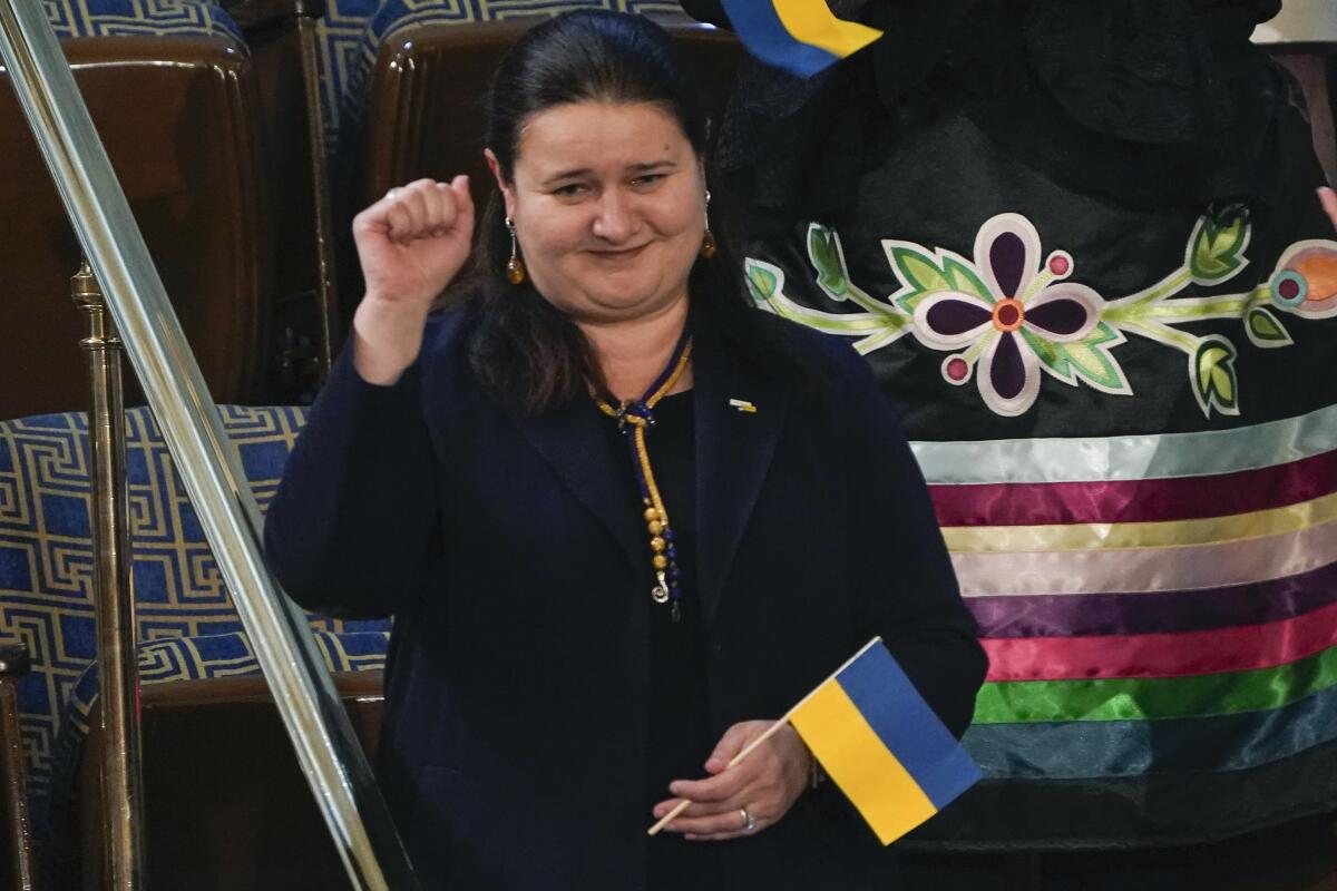 Ukraine Ambassador to the United States Oksana Markarova raises a fist.