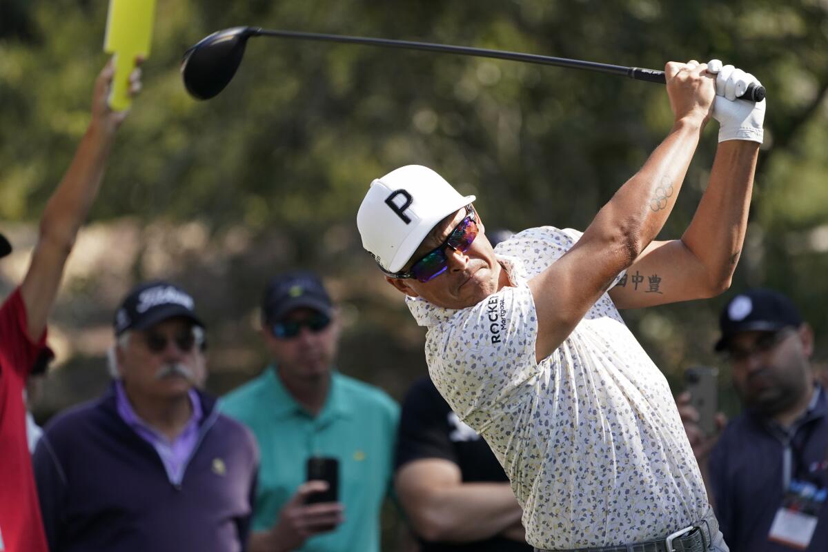 Rickie Fowler follows his drive from the 18th tee of the Silverado Resort North Course during the first round of the Fortinet Championship PGA golf tournament in Napa, Calif., Thursday, Sept. 15, 2022. (AP Photo/Eric Risberg)