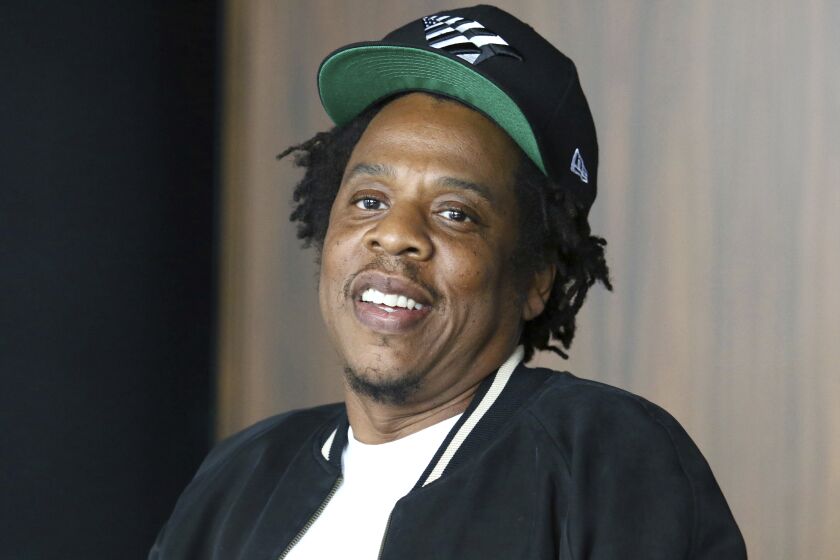 FILE - In this July 23, 2019, file photo, Jay-Z makes an announcement of the launch of Dream Chasers record label in joint venture with Roc Nation, at the Roc Nation headquarters in New York. The NFL and Jay-Z’s entertainment and sports representation company are teaming up for events and social activism. The league not only will use Jay-Z’s Roc Nation to consult on its entertainment presentations, including the Super Bowl halftime show, but will work with the rapper and entrepreneur’s company to “strengthen community through music and the NFL's Inspire Change initiative.” (Photo by Greg Allen/Invision/AP, File)