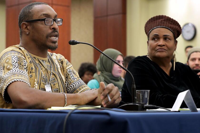 Muhammad Ali Jr., left, son of the late boxing legend, and his mother, Khalilah Camacho Ali, participate in a forum about immigration enforcement at the Capitol in Washington.