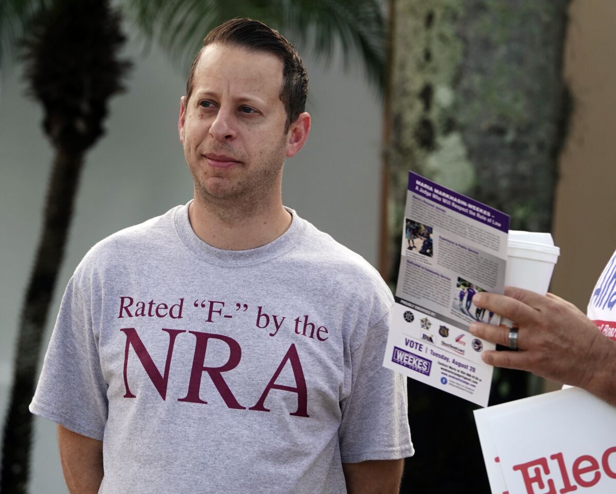 FILE - Jared Moskowitz, running for re-election to the Florida State House of Representatives, stands outside a polling place in Tamarac, Fla., Tuesday, Aug. 28, 2018. On Friday, March 4, 2022, Democratic Broward County Commissioner Moskowitz announced that he will run for the South Florida congressional seat being vacated by Democratic Rep. Ted Deutch. (Joe Cavaretta/South Florida Sun-Sentinel via AP, File)
