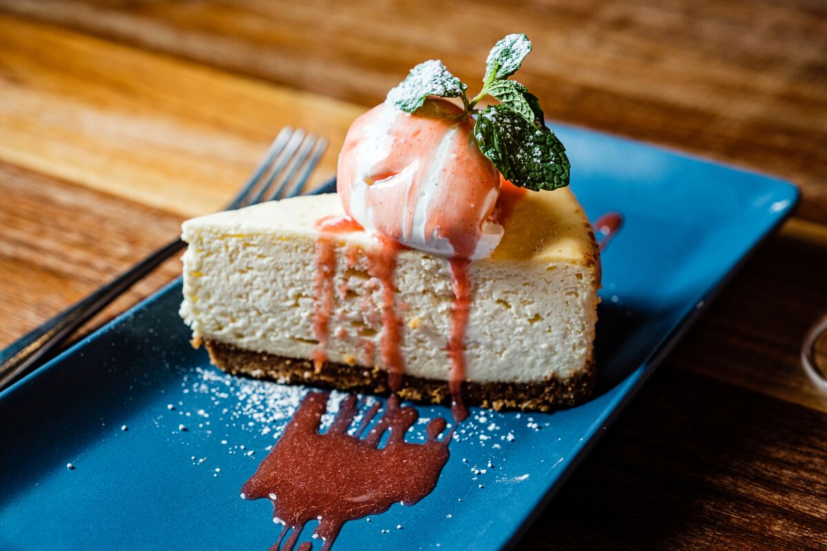 Goat Cheese Cheesecake served with seasonal fruit.