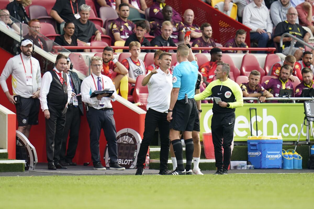 Leeds United manager Jesse Marsch is shown a red card during their English Premier League soccer match against Brentford at the Gtech Community Stadium, London, Saturday, Sept. 3, 2022. (Andrew Matthews/PA via AP)