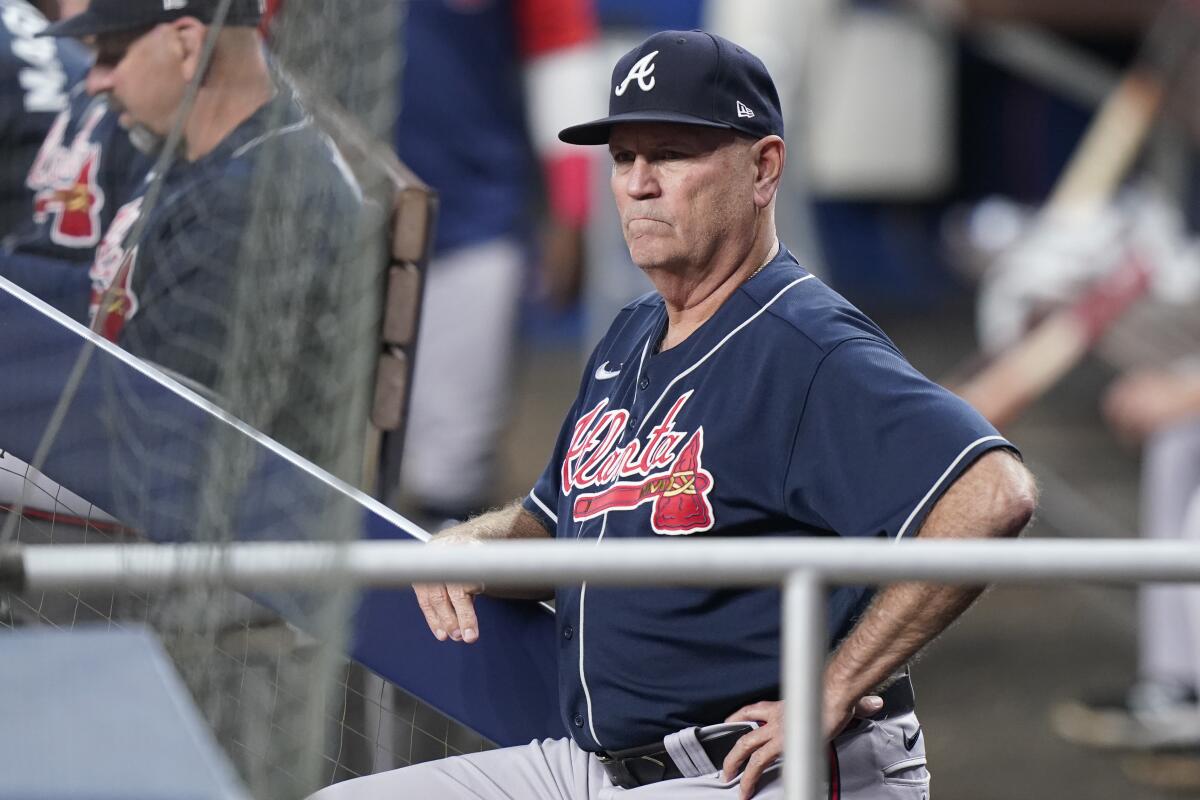 Atlanta Braves manager Brian Snitker looks on during the fourth inning of a baseball game against the Miami Marlins, Monday, Oct. 3, 2022, in Miami. (AP Photo/Wilfredo Lee)