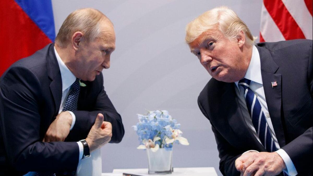 Russian President Vladimir Putin, left and President Trump confer at the G-20 Summit in Hamburg, Germany, last year.