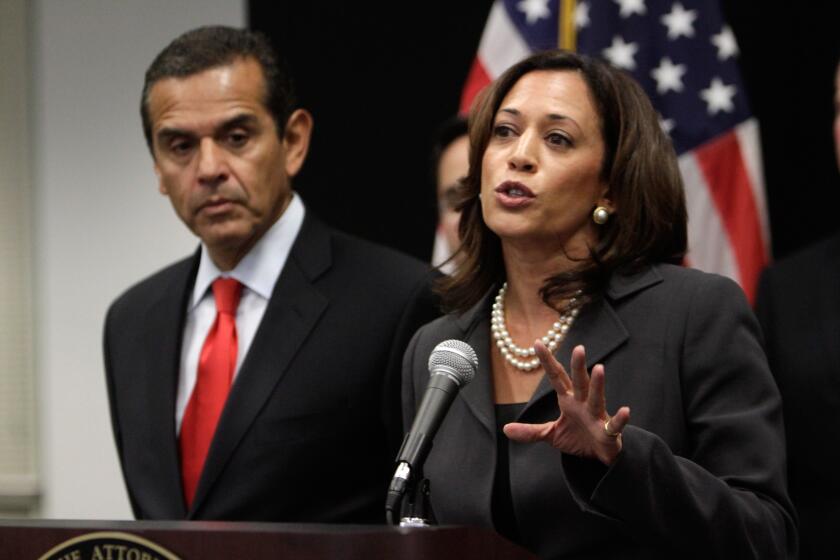 Melcon, Mel –– B581291146Z.1 LOS ANGELES, CA–MAY 23, 2011: Attorney General Kamala Harris is photographed during a press conference where she announced the creation of the California Attorney General's Mortgage Fraud Strike Force, staffed by Department of Justice attorneys and investigators charged with protecting innocent homeowners and bringing to justice those who defraud them. In background is Paul Leonard, Director of the Center for Responsible Lending. Press conference was held at the Attorney General's office in Downtown Los Angeles on May 23, 2011. (Mel Melcon/Los Angeles Times)