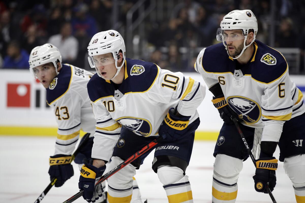 Buffalo's Conor Sheary (43), Henri Jokiharju (10) and Marco Scandella (6) wait for a faceoff during the second period of their game against the Kings on Oct. 17, 2019.