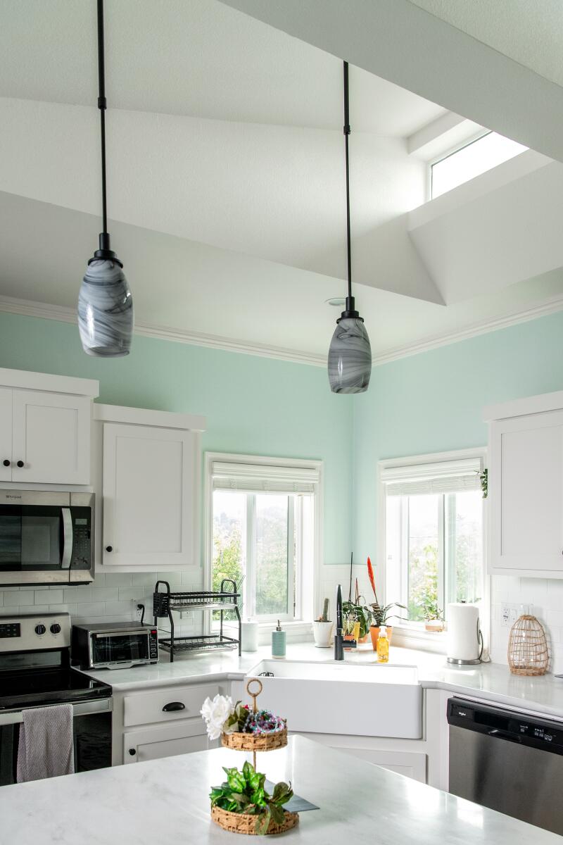 The full kitchen features a cozy window seat.