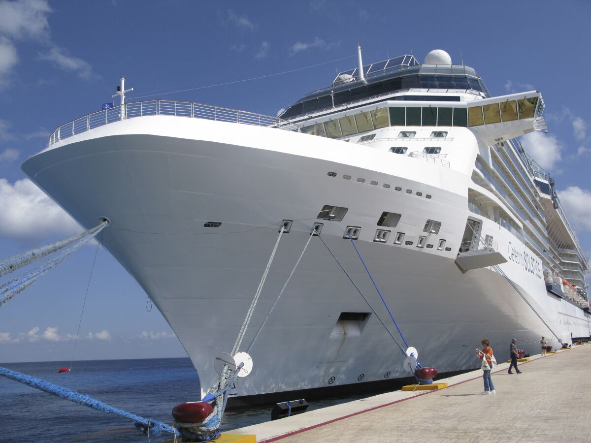 FILE - In this June 9, 2010 file photo, the Celebrity cruise ship Solstice is docked in Cozumel, Mexico. With tourism shattered by the COVID-19 pandemic in 2021, Mexico's Caribbean island of Cozumel is planning with the backing of President Andres Manuel Lopez Obrador another dock for cruise ships. (AP Photo/J Pat Carter, File)