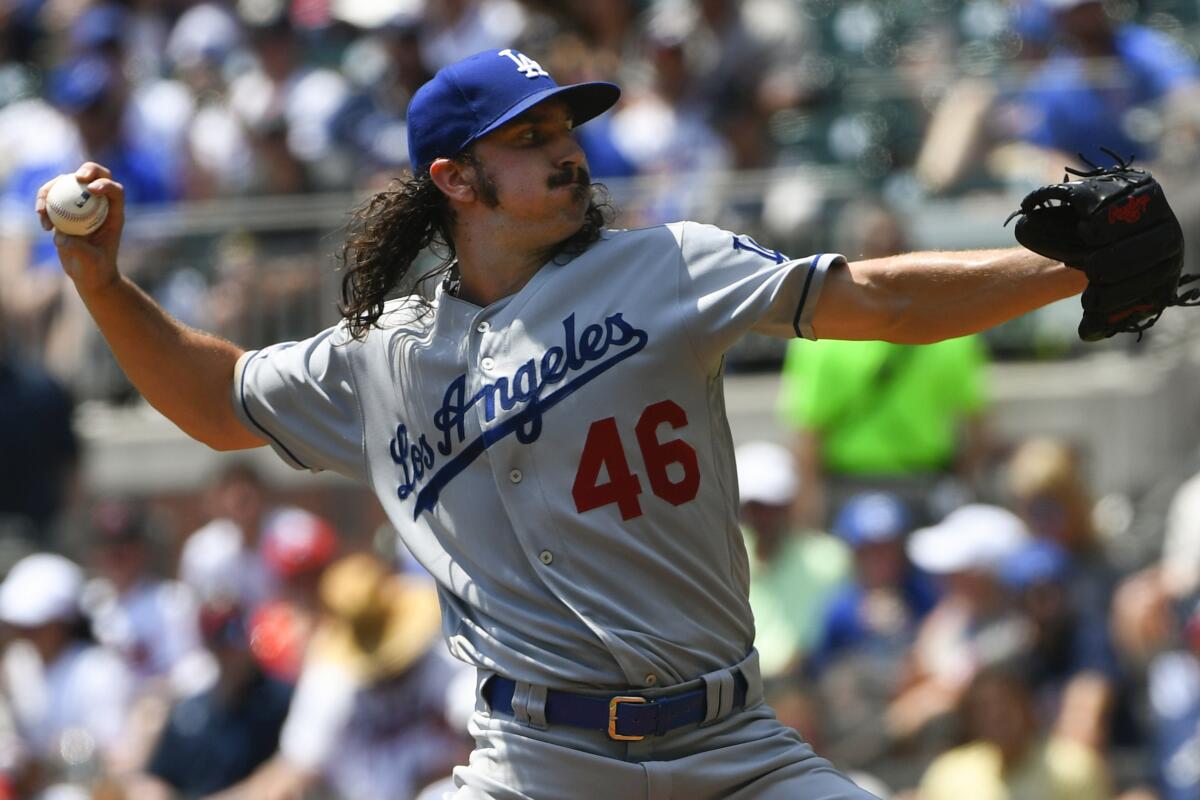 Dodgers pitcher Tony Gosolin delivers against the Atlanta Braves on Sunday.