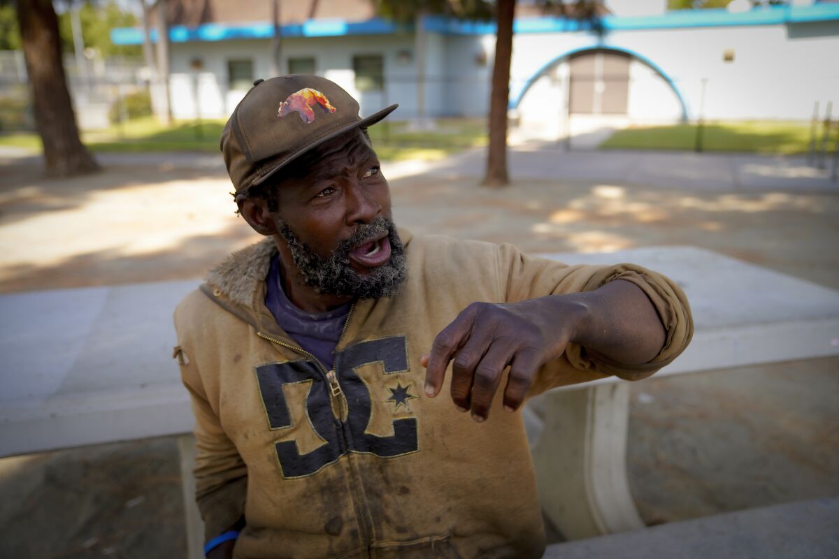 Matthew Clark, 55, sits on a bench at Wells Park in El Cajon.