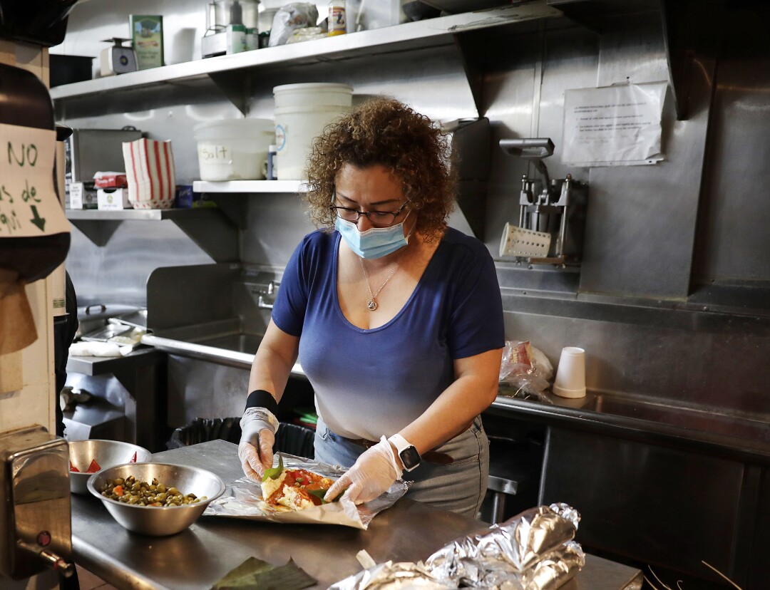 What the 'tamale poll' says about coronavirus, Christmas and
large gatherings 1 Milbet Del Cid makes traditional Guatemalan tamales at Amalia's Restaurant in Los Angeles.