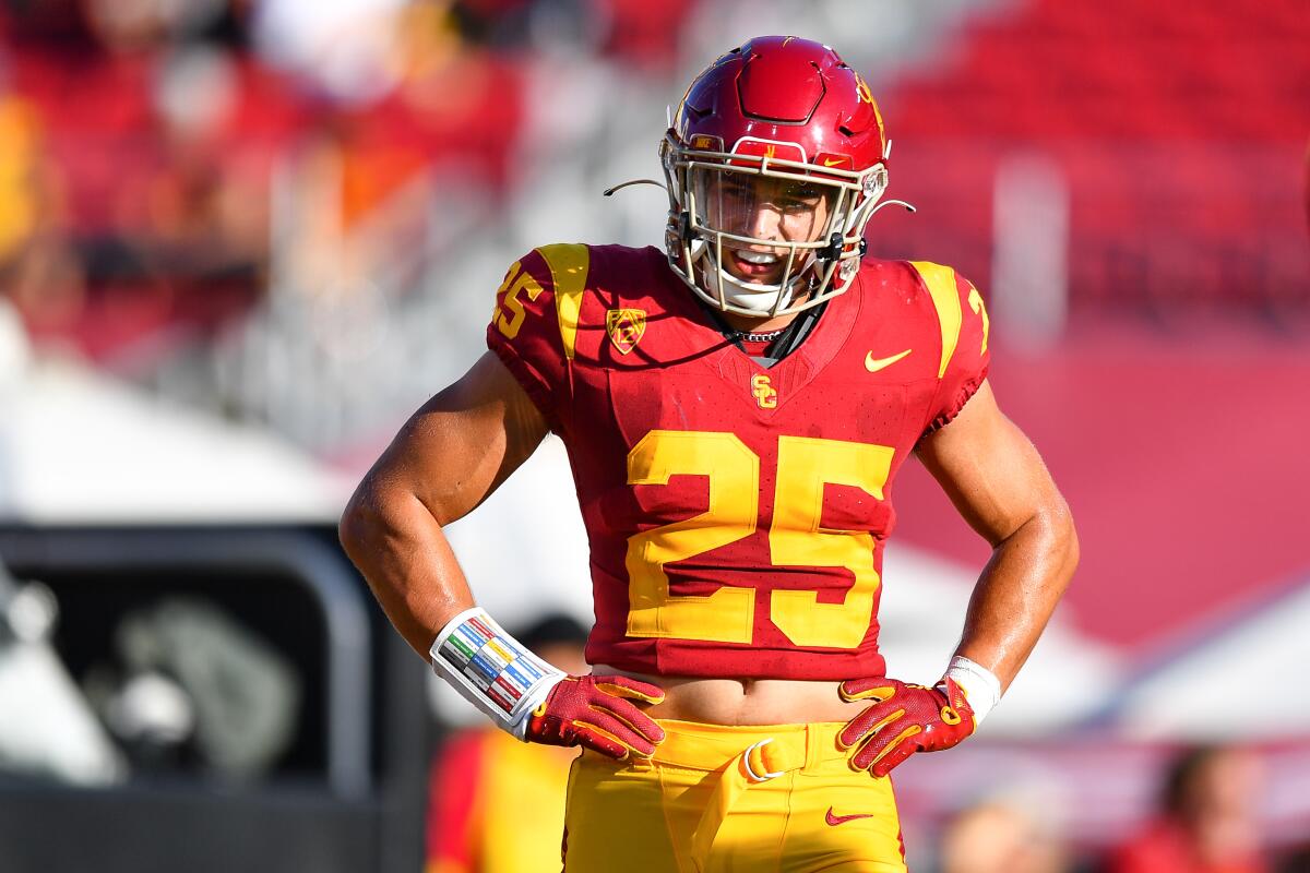 USC linebacker Tackett Curtis stands with his hands on hips and looks up the field during the Trojans' win Saturday
