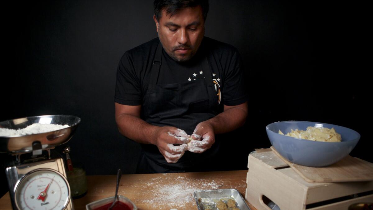 Ricardo Zarate has partnered with Feastly to host a pop-up dinner in downtown L.A. to preview his new restaurant. Pictured is Zarate making foie gras churros.
