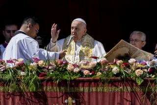Pope Francis delivers his Easter message at the Vatican on Sunday.