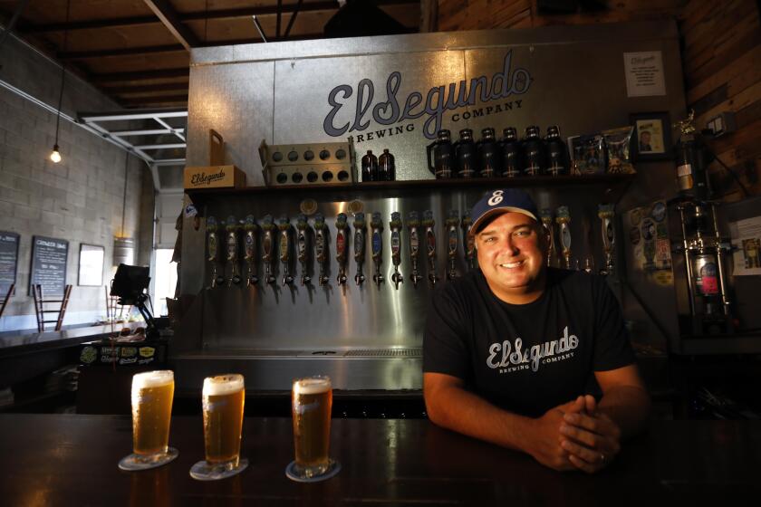 EL SEGUNDO, CA - SEPTEMBER 26, 2019 - - Rob Croxall, president and head brewer of El Segundo Brewing Company, rests behind the bar at the establishment in El Segundo on September 26, 2019. (Genaro Molina / Los Angeles Times)