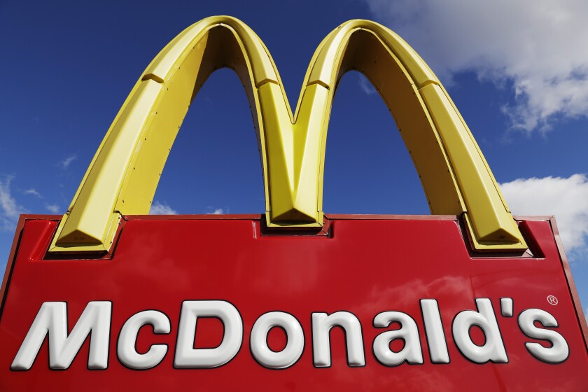 FILE - This April 9, 2020 file photo shows a McDonald's sign in Wheeling, Ill. McDonald’s ended 2020 on a strong note, recovering nearly all of the global sales lost in the pandemic despite a resurgent virus. (AP Photo/Nam Y. Huh, File)