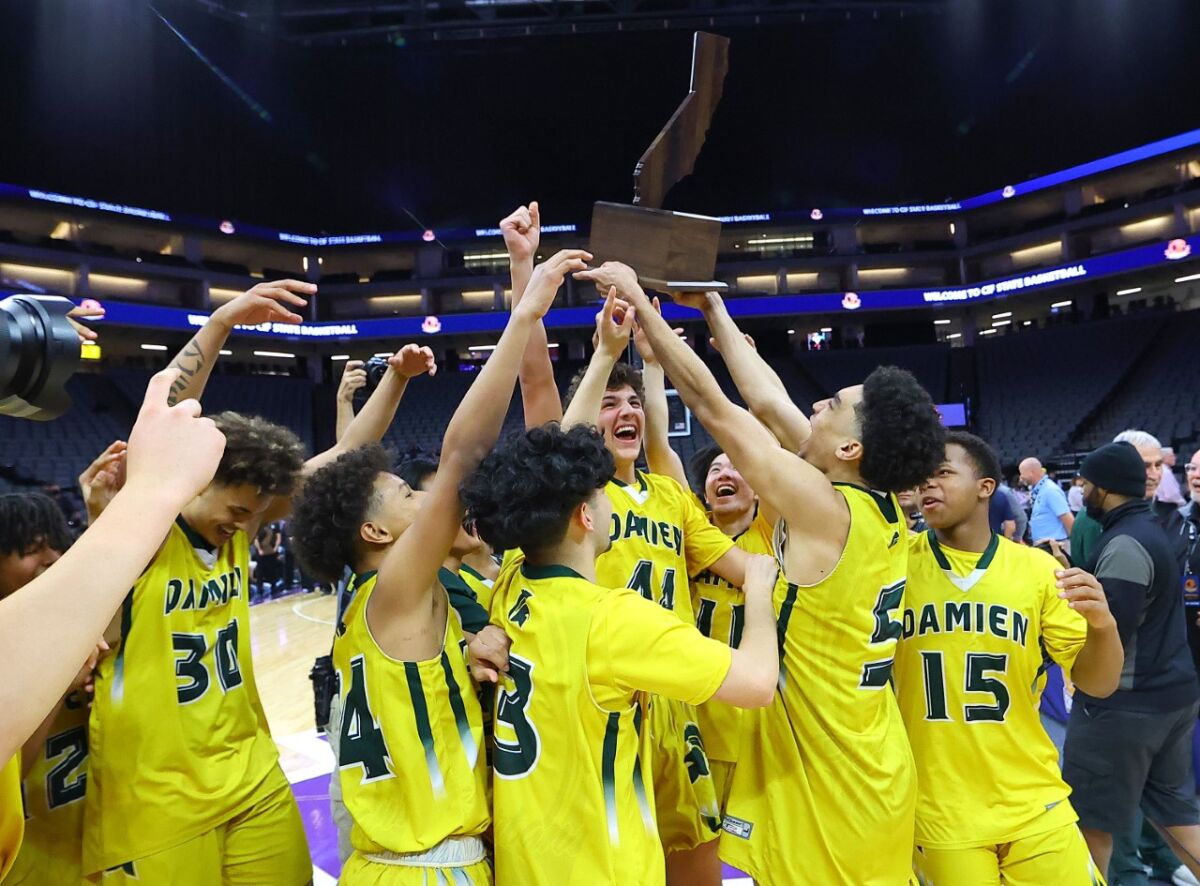 Damien players celebrate Division I state title.