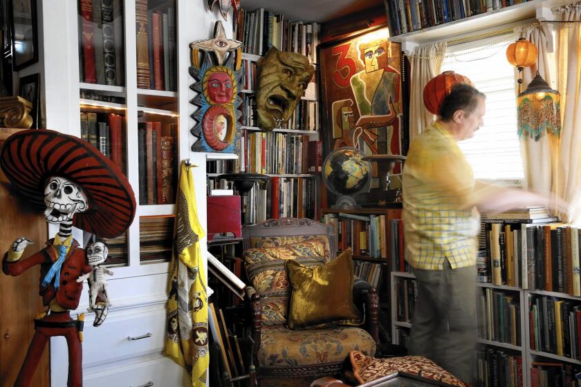 John Iacovelli's library, formerly the living room of a second unit built in 1959, is filled with art and architecture books.