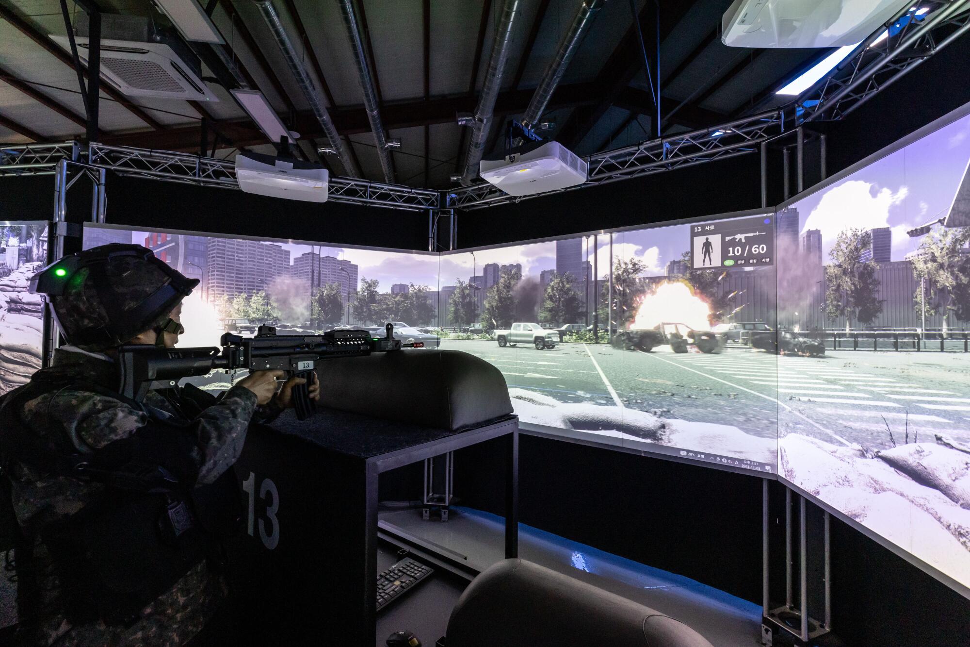 A member of the Senior Army participates in a VR session of urban warfare during military training 