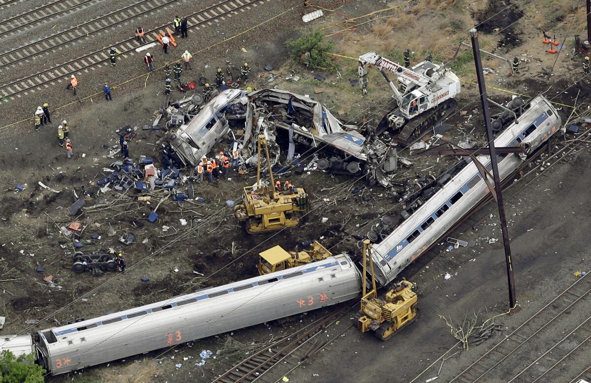 Emergency personnel work at the scene of a derailment in Philadelphia of an Amtrak train headed to New York on May 13, 2015.