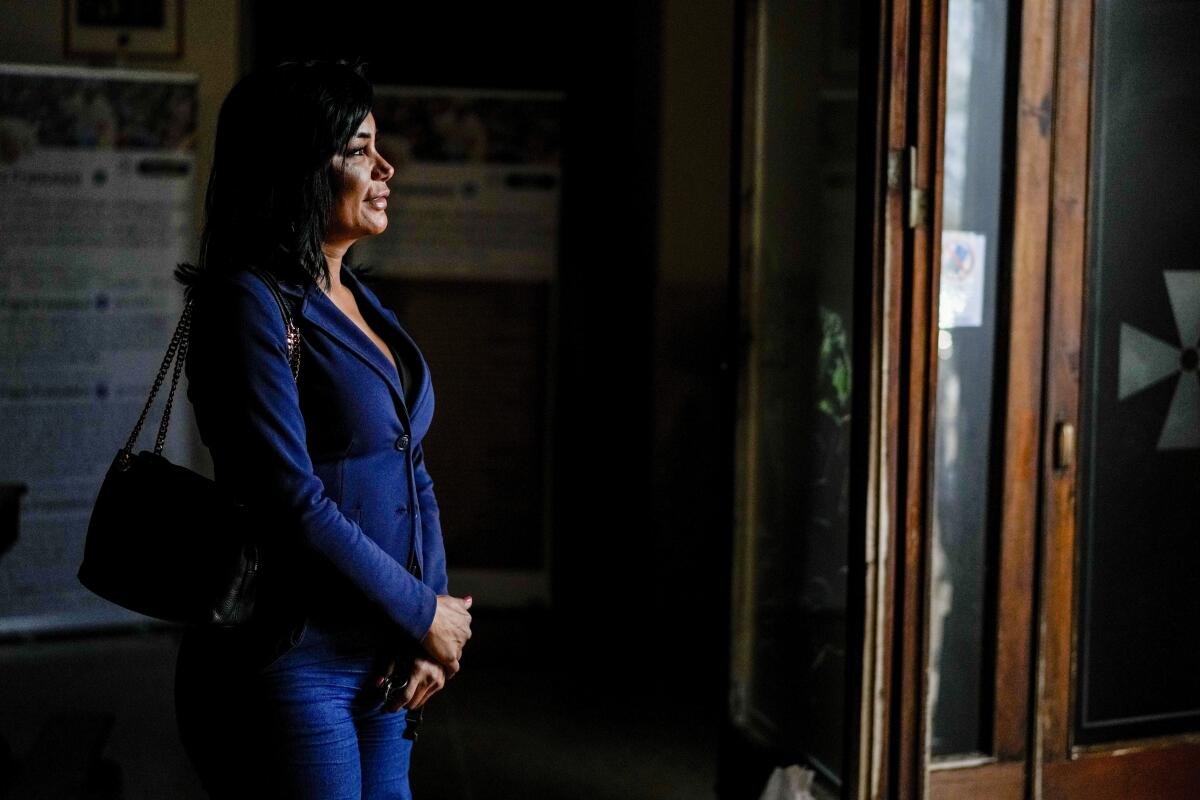 Carla Segovia, a transgender woman, walks out of a church 