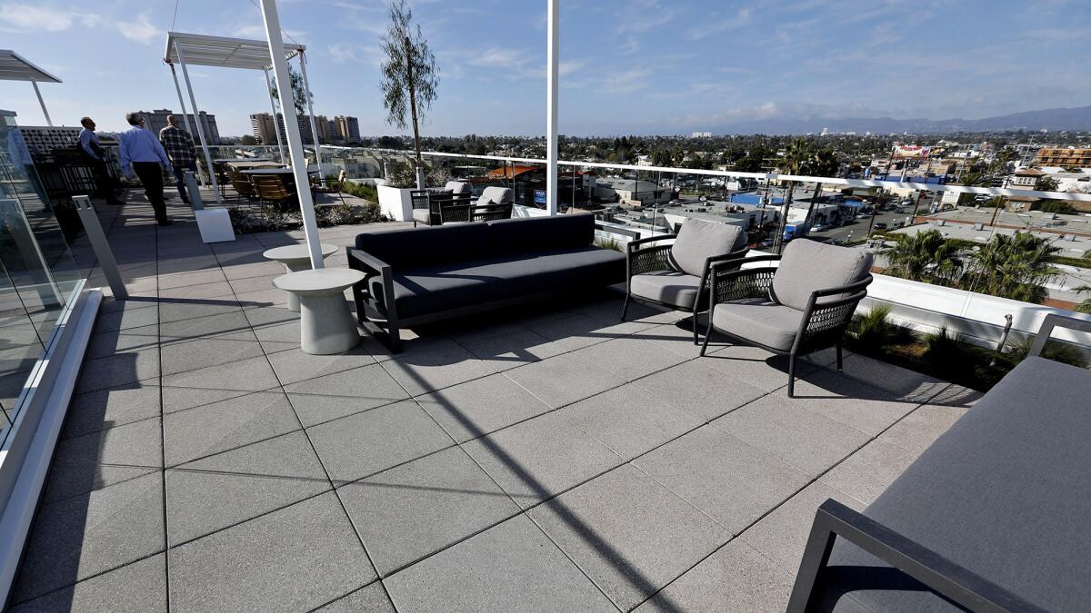 The roof of the C1 apartment complex features a pool and lounge area.