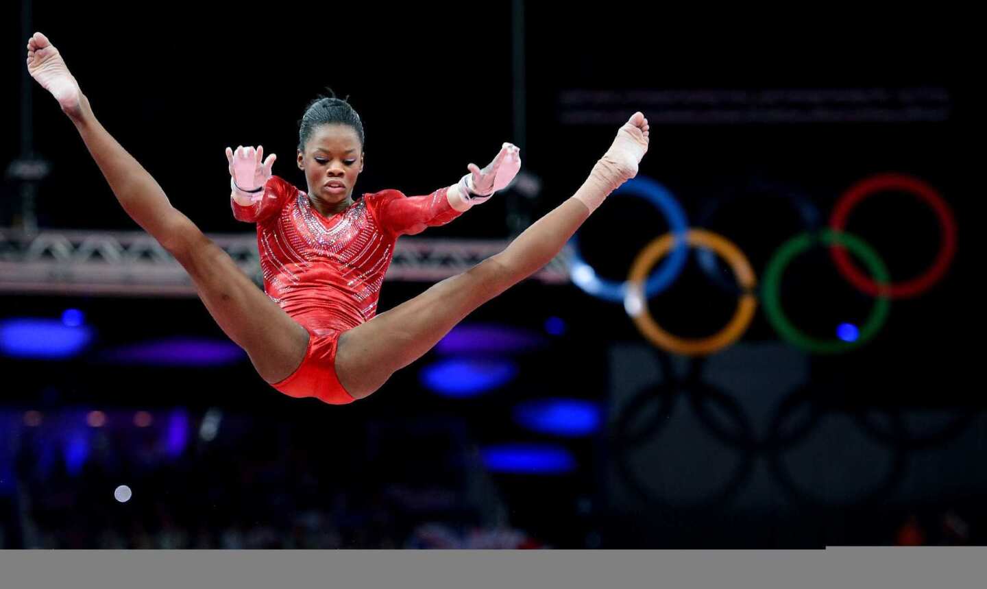 Called "Flying Squirrel" for her soaring release moves, Gabrielle Douglas performs her routine on the uneven bars in London. After competing in four events to lead the U.S. to team gold, she's considered a strong candidate for top honors in the individual all-around as well.