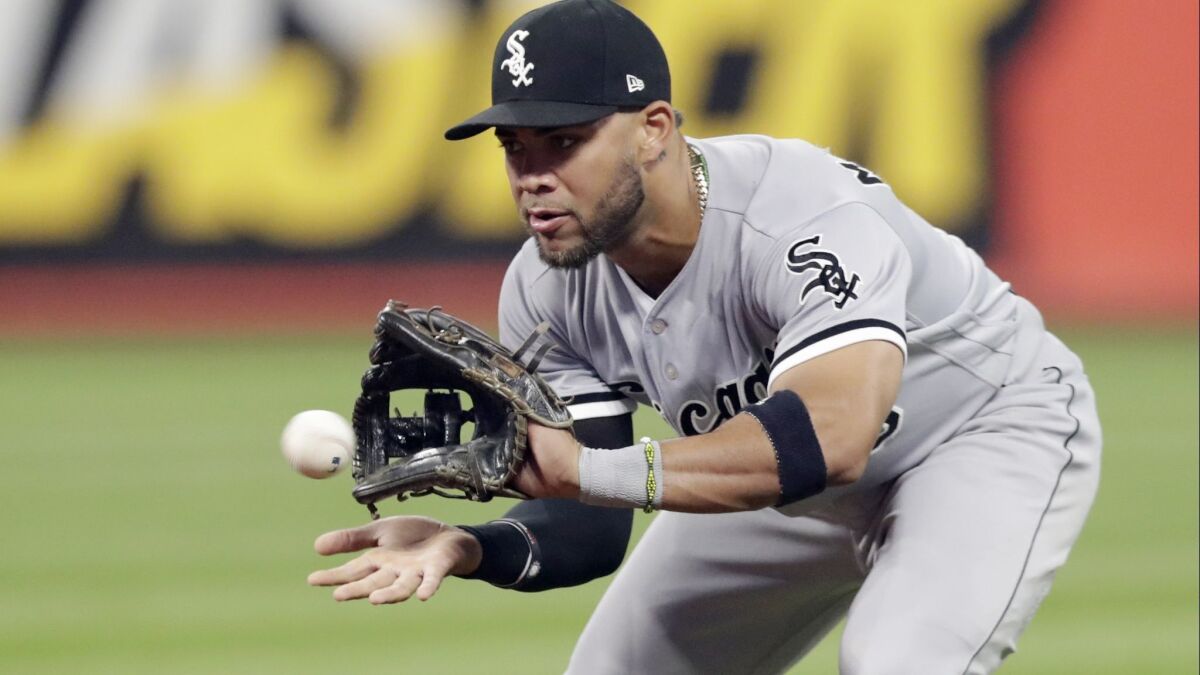 In this Sept. 19, 2018, file photo, Chicago White Sox's Yoan Moncada fields a ball hit by Cleveland Indians' Melky Cabrera during the fourth inning of a baseball game in Cleveland. Cabrera was out on the play.