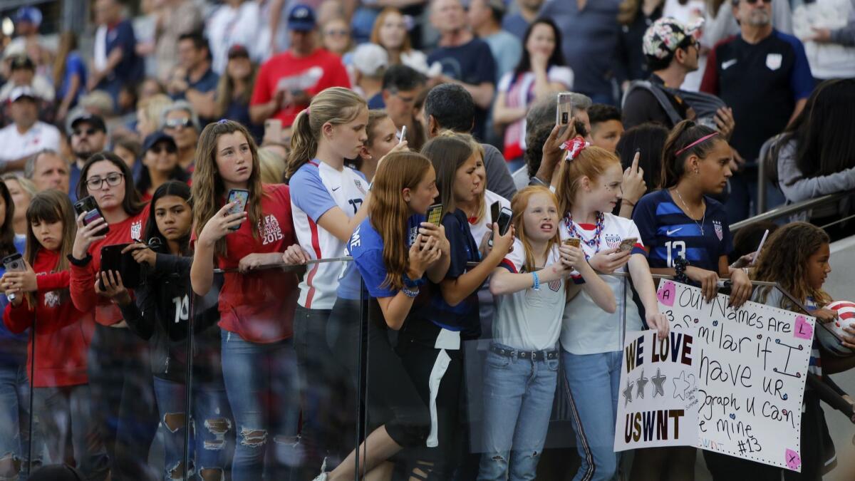 Fans wait for the U.S. women's national soccer team before their game against Belgium.