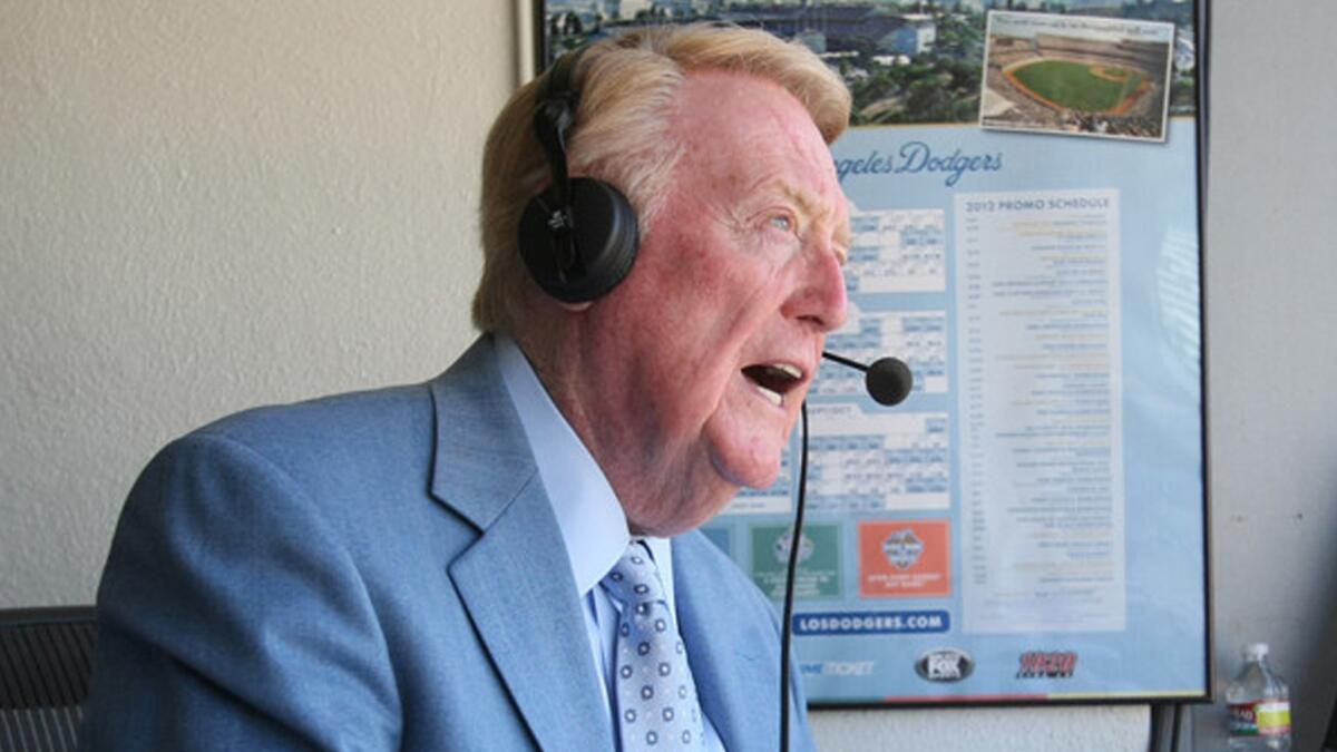 Longtime Dodgers broadcaster Vin Scully in the booth calling a Dodgers game.
