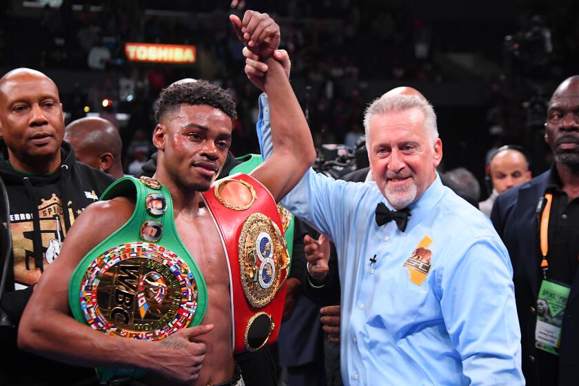 LOS ANGELES, CA - SEPTEMBER 28: Referee Jack Reiss in in the ring with Erroll Spence Jr. after he defeated Shawn Porter (not pictured) in their IBF & WBC World Welterweight Championship fight at Staples Center on September 28, 2019 in Los Angeles, California. Spence, Jr won by decision. (Photo by Jayne Kamin-Oncea/Getty Images) ** OUTS - ELSENT, FPG, CM - OUTS * NM, PH, VA if sourced by CT, LA or MoD **