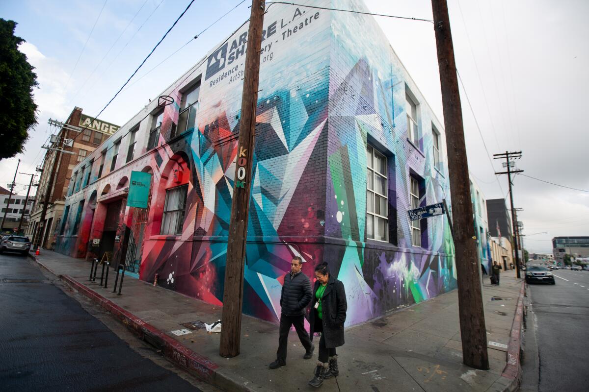 People walk past the Art Share L.A. building 