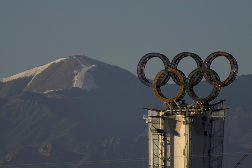 Olympic Rings assembled atop of a structure stand out near a ski resort on the outskirts of Beijing, China, Thursday, Jan. 13, 2022. The Chinese capital is gearing up for the Winter Olympics the midst of COVID-19 outbreaks in several Chinese cities which have been locked down. (AP Photo/Ng Han Guan)