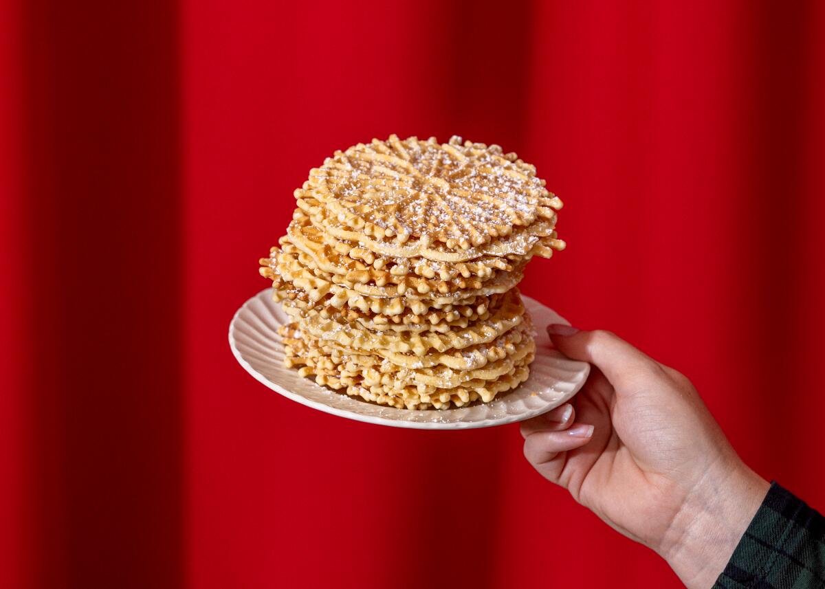 A stack of thin and crispy Italian pizzelle cookies