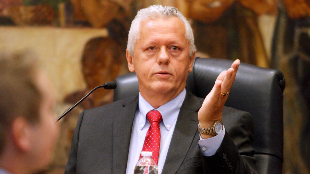 Burbank Mayor Will Rogers gestures during a City Council meeting in 2015.