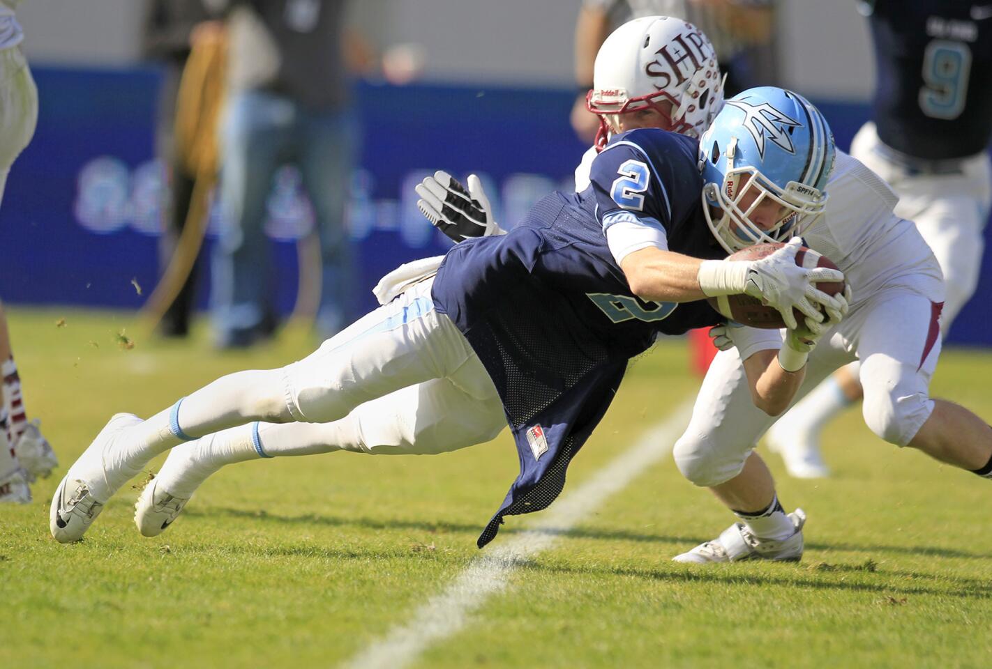 Corona del Mar High's Bo St. Geme (2) dives in for the first touchdown of the game during the first half against Sacred Heart Prep in the 2013 CIF State Football Division III Bowl Championship Game at StubHub Center in Carson on Saturday. (Kevin Chang/ Daily Pilot)
