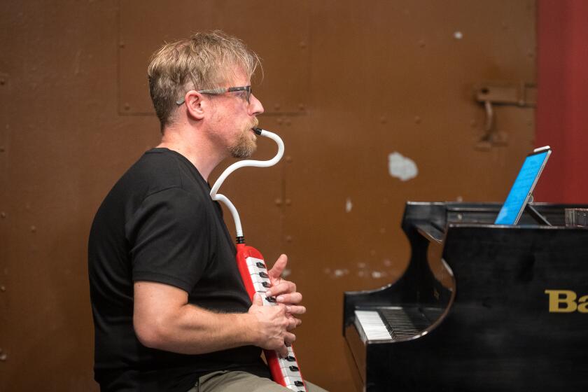LOS ANGELES, CA - JUNE 21, 2022: Aron Kallay plays a melodica while performing with the Brightwork Ensemble at Tuesdays @ Monk Space in Los Angeles. (Michael Owen Baker / For The Times)