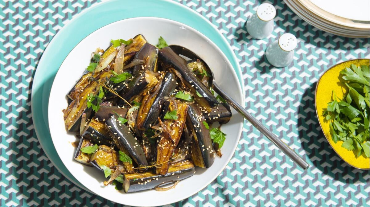 Frying eggplant wedges before marinating infuses them with olive oil's richness.