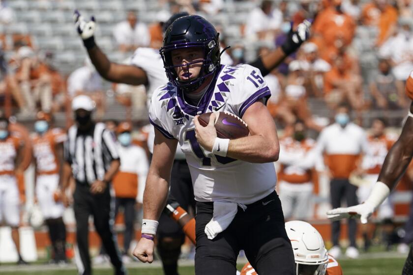 TCU quarterback Max Duggan (15) scores a touchdown on a run against Texas.