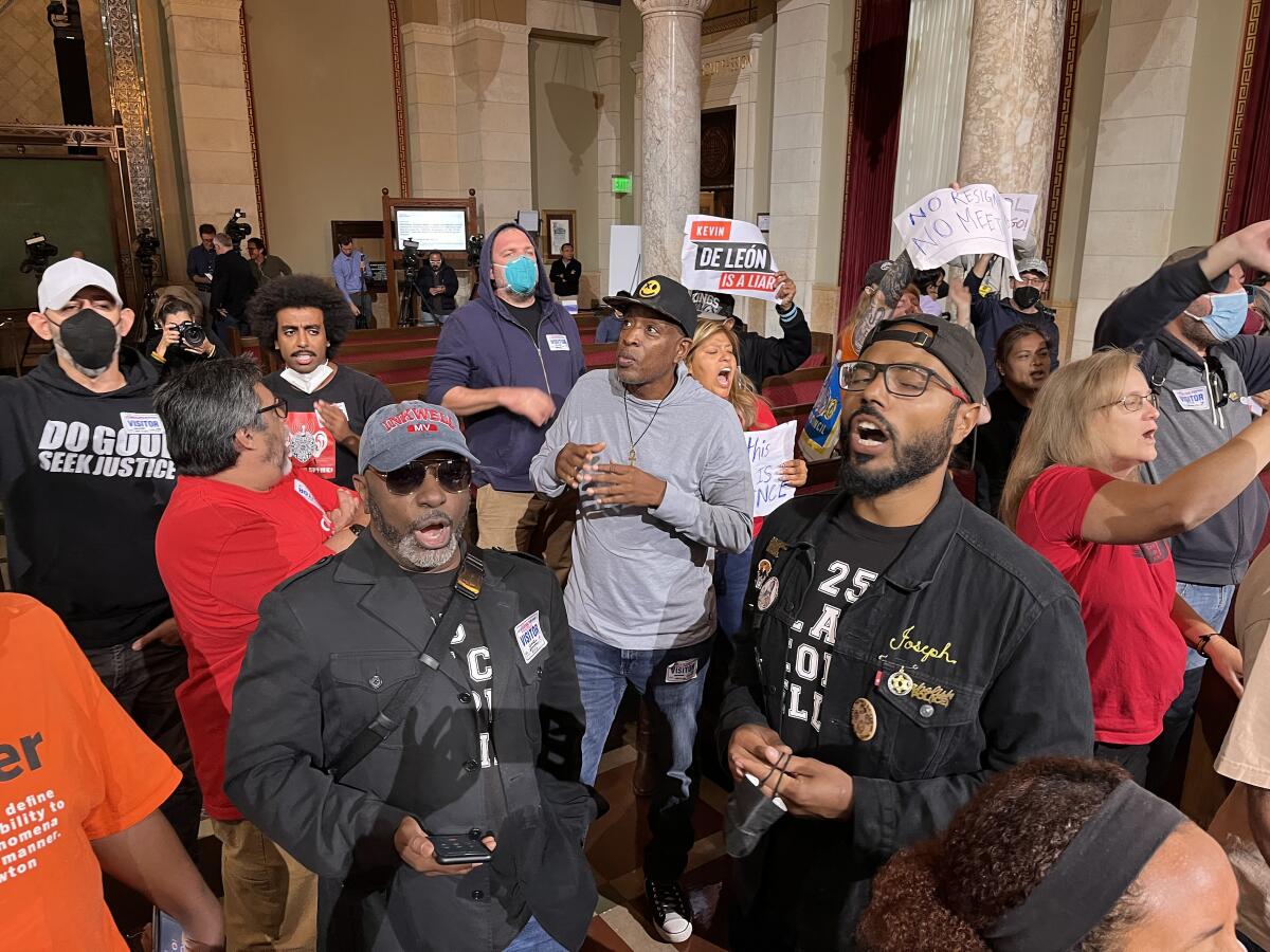 A group of protesters chanted throughout the Los Angeles city council meeting