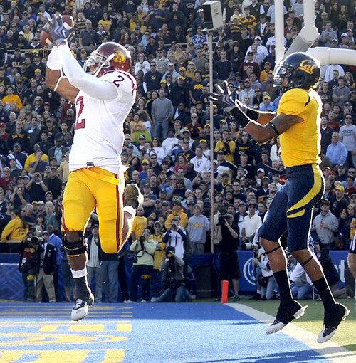 USC safety Taylor Mays intercepts a pass in front of California receiver Marvin Jones in the end zone in the first quarter Saturday.
