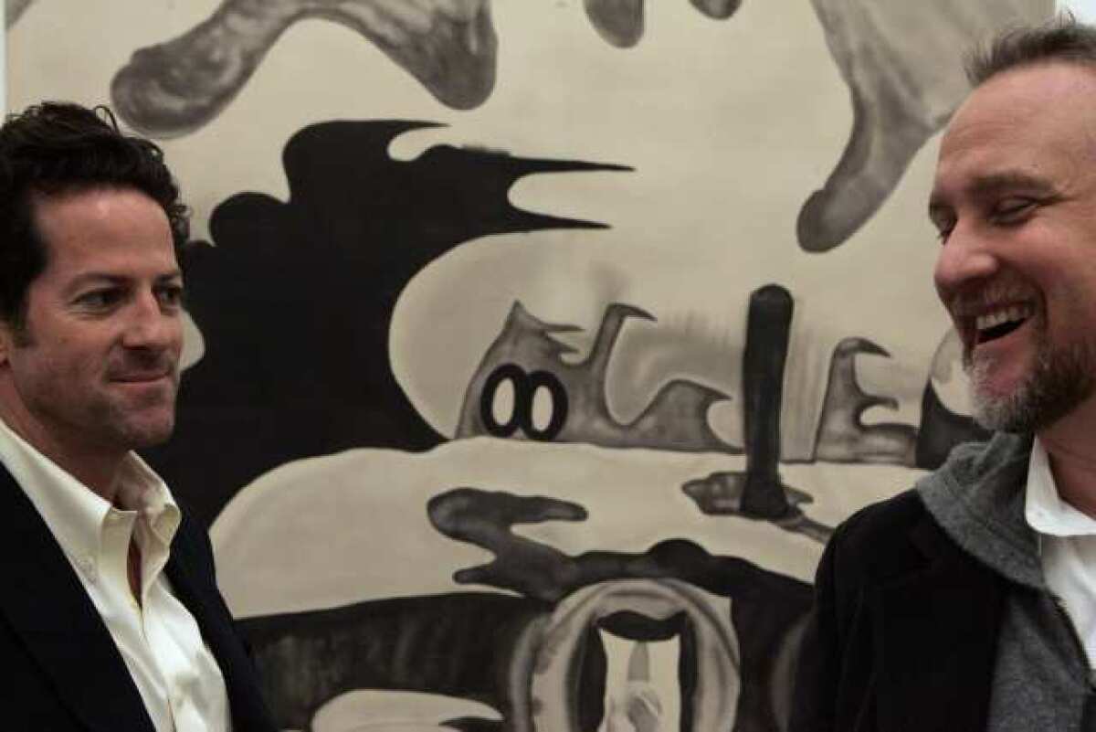 Timothy Blum, left, and Jeff Poe, co-owners of Blum & Poe, stand in front of an untitled piece by artist Chris Vasell in 2007.