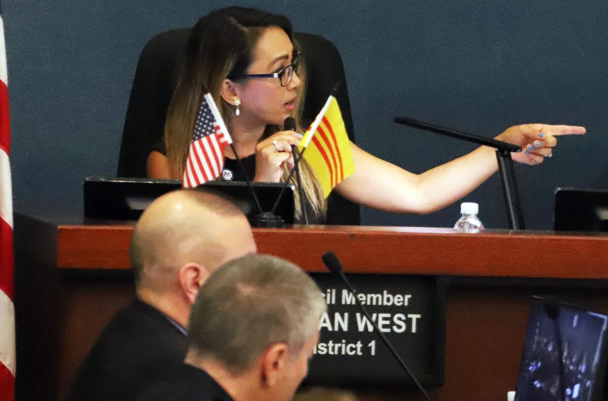 Phan West defends her position during City Council.